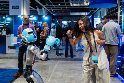 An attendee interacts with a robotics demonstration on the exhibition floor at Consensus Hong Kong 2026. An attendee interacts with a robotics demonstration on the exhibition floor at Consensus Hong Kong 2026.